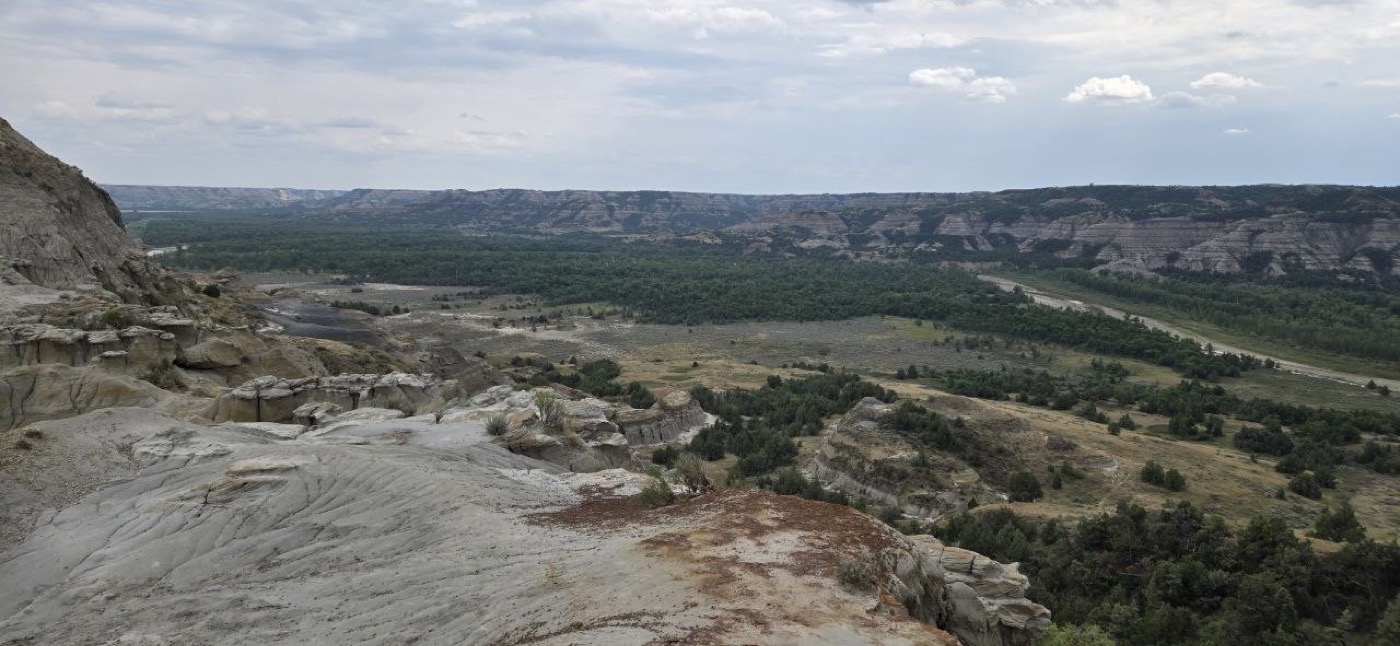 The Little Missouri River winding through layered badlands buttes, seen from River Bend Overlook