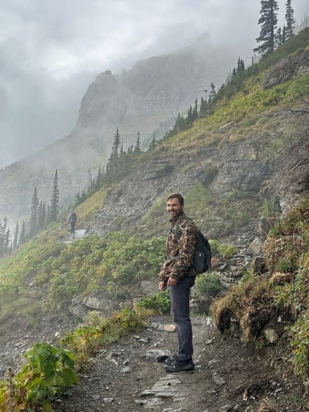Wearing the Drake Waterfowl Lightweight Packable Jacket on the trail in Glacier National Park