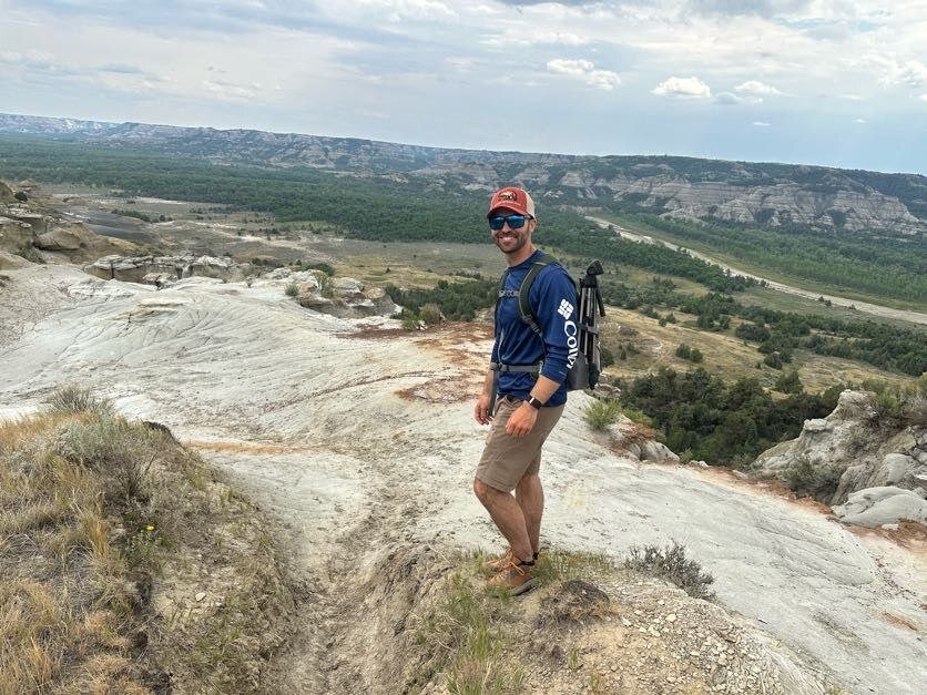 Standing at an overlook in Theodore Roosevelt National Park&rsquo;s badlands, North Dakota.