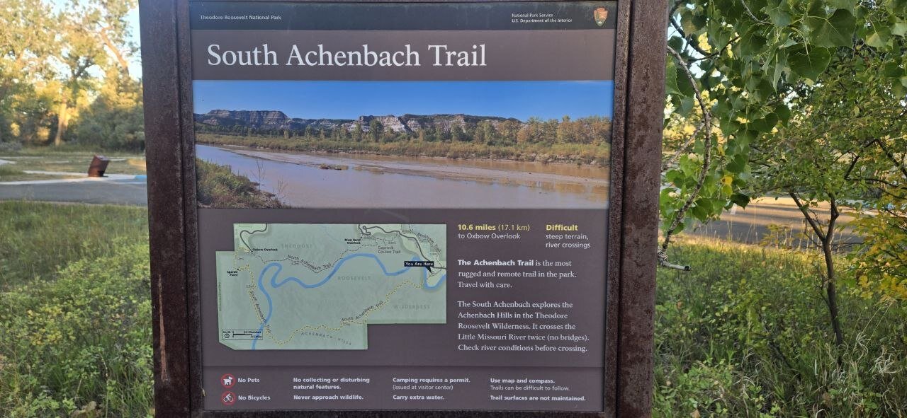 The official NPS trailhead sign for South Achenbach Trail, showing the map and distance to Oxbow Overlook.
