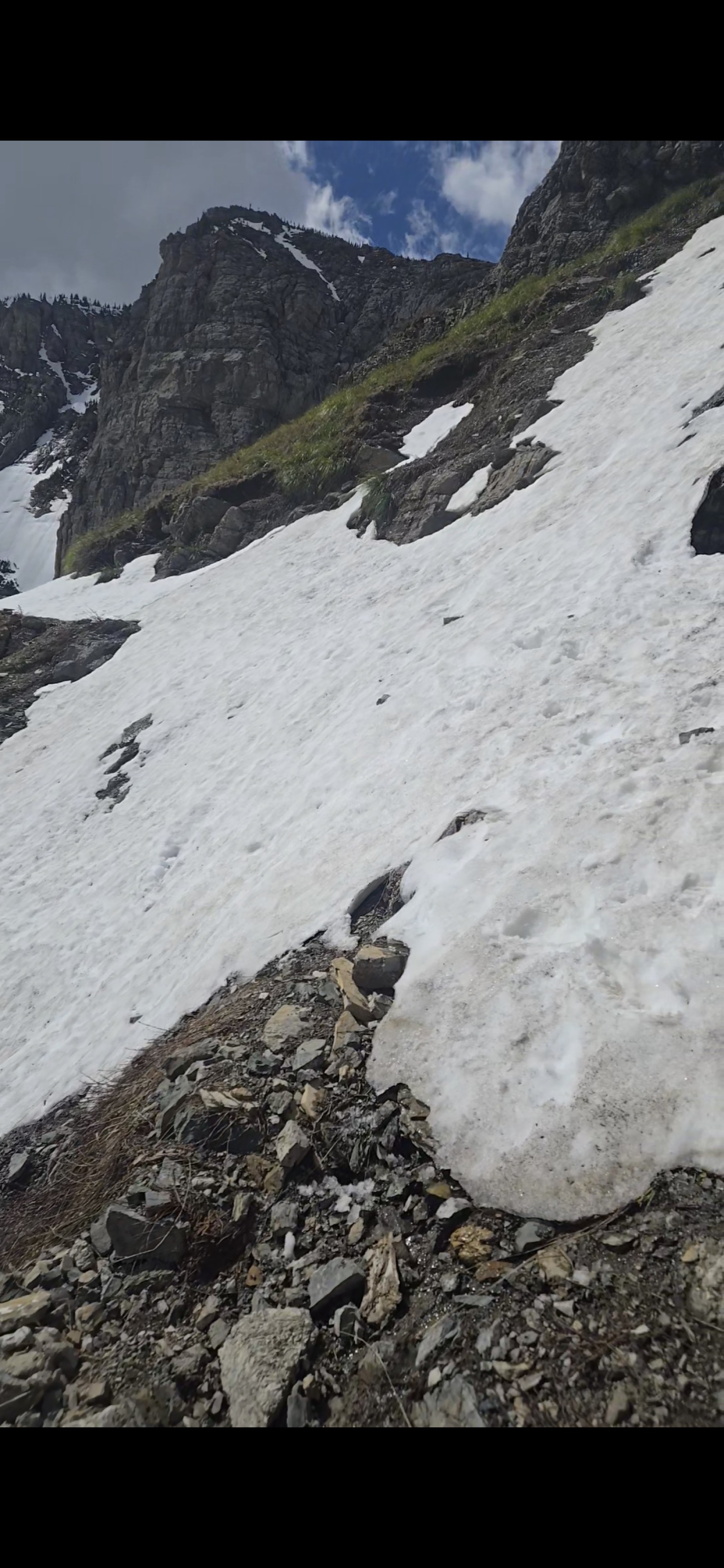 Steep snowfield crossing the trail at roughly the 5.5-mile mark on the climb to Swiftcurrent Pass